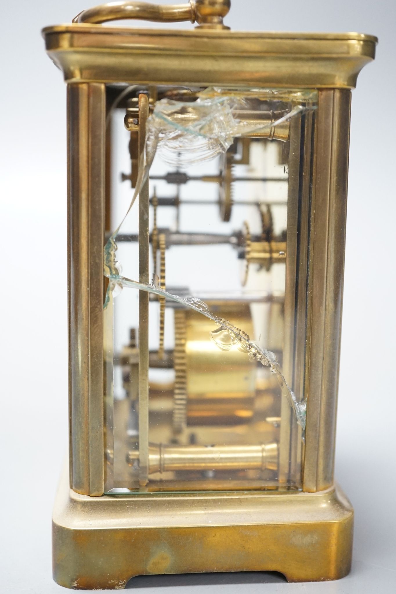 A cased brass carriage timepiece, 10.5 cms high high not including case.